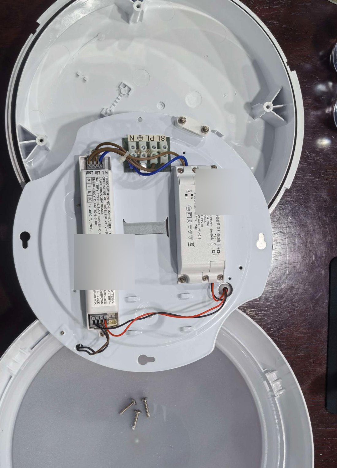 Round bulkhead fitting opened, showing the gear tray